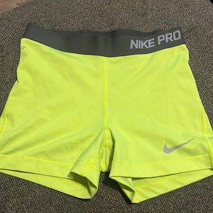 Neon yellow Nike Pros